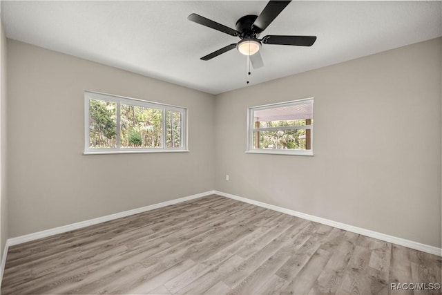 1361 NW 19th St, Crystal River, FL 34428 - spare room with plenty of natural light, wood finished floors, and ceiling fan