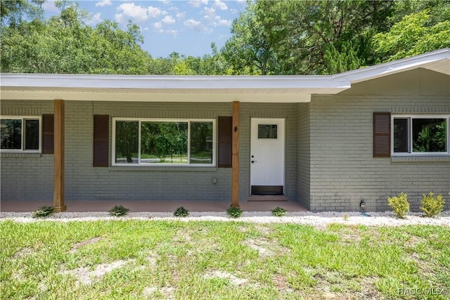 1361 NW 19th St, Crystal River, FL 34428 - entrance to property with brick siding and a porch