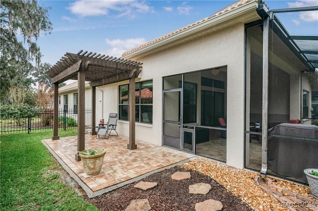 rear view of house featuring a patio, fence, a lawn, stucco siding, and a pergola