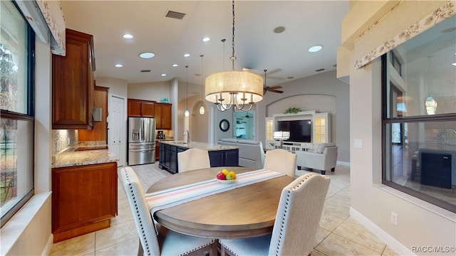 dining space with lofted ceiling, light tile patterned floors, visible vents, and recessed lighting