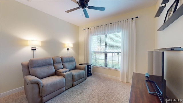 living room featuring carpet floors, vaulted ceiling, baseboards, and ceiling fan