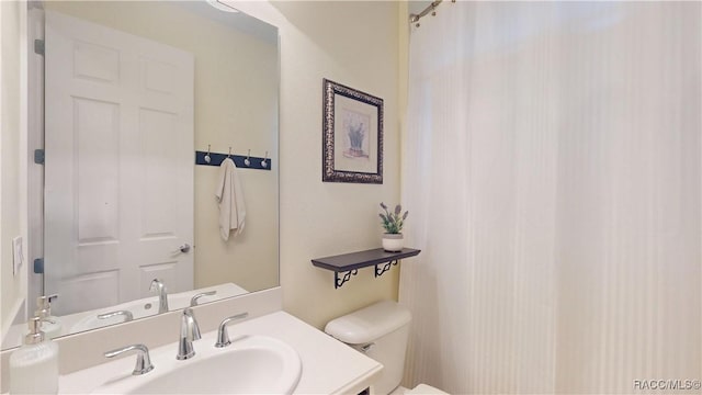 bathroom with vanity and toilet