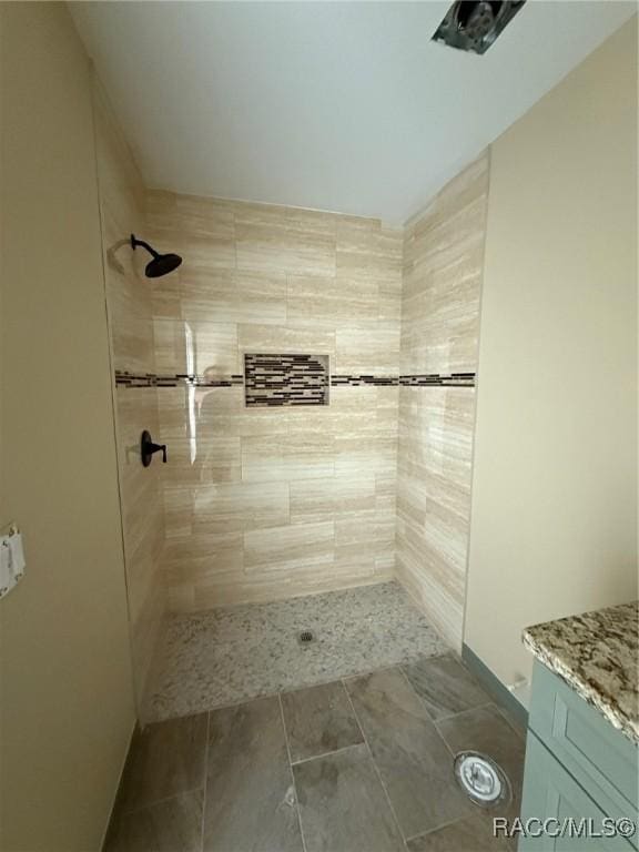 bathroom with tiled shower