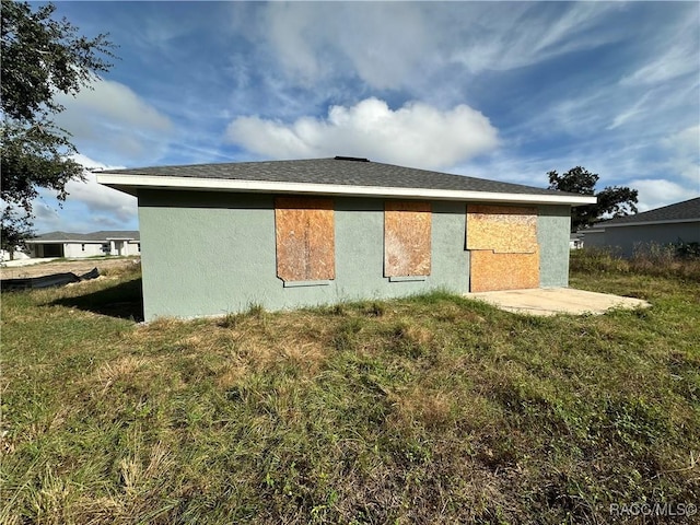 view of property exterior with a yard