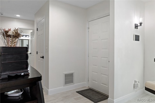 foyer entrance with light hardwood / wood-style flooring