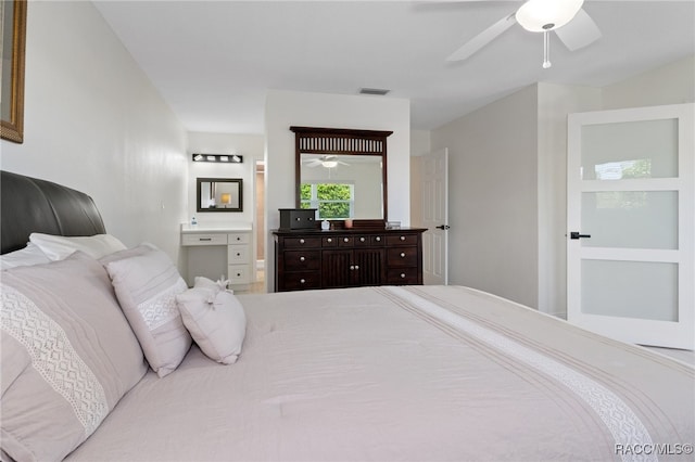 bedroom with ensuite bathroom and ceiling fan