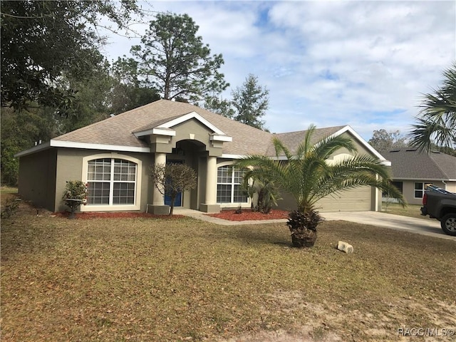 ranch-style house featuring stucco siding, a front lawn, concrete driveway, a shingled roof, and a garage