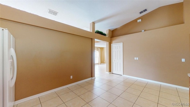 spare room featuring light tile patterned floors, baseboards, and visible vents