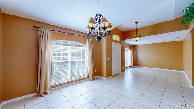 empty room featuring baseboards and a wealth of natural light