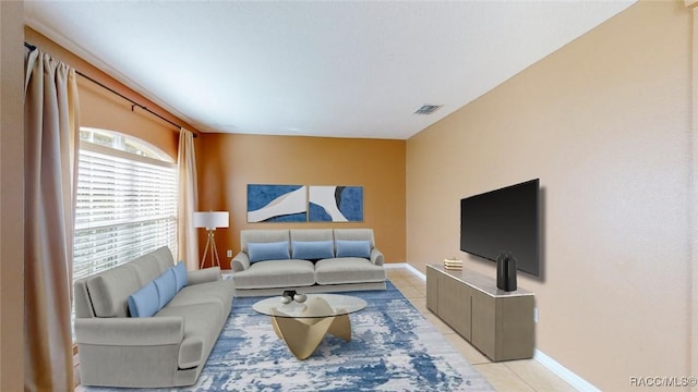 living room with light tile patterned flooring, baseboards, and visible vents