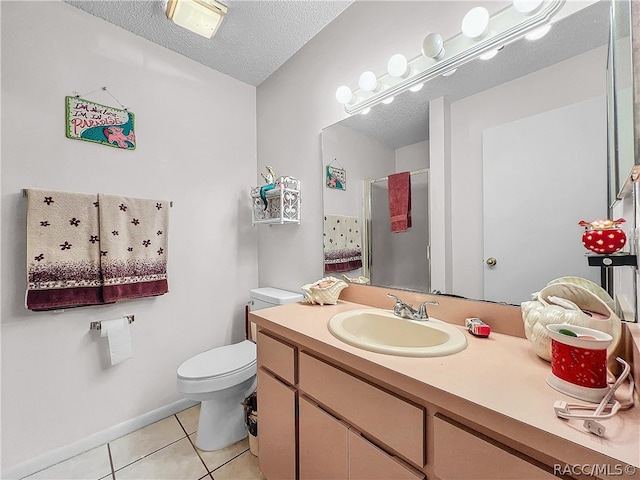 bathroom featuring walk in shower, tile patterned flooring, a textured ceiling, toilet, and vanity