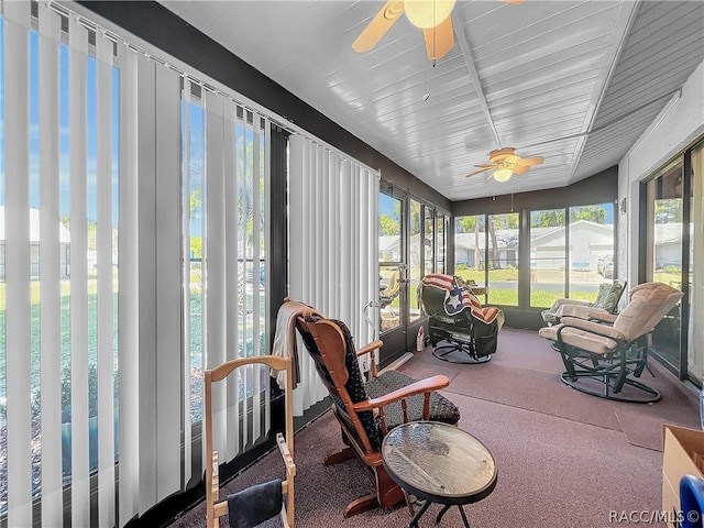 sunroom with a wealth of natural light and ceiling fan