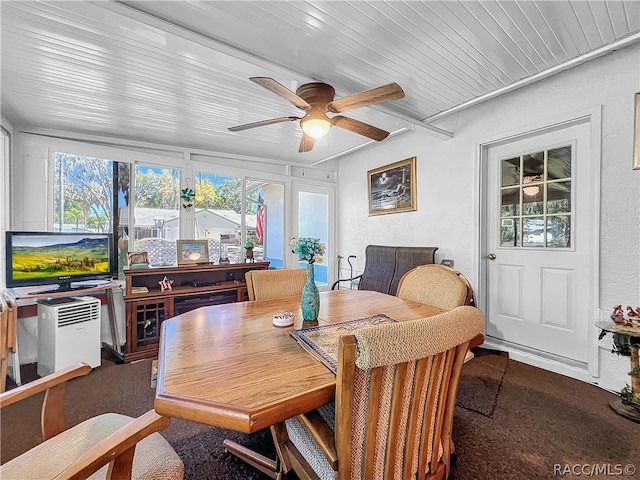 sunroom / solarium featuring ceiling fan