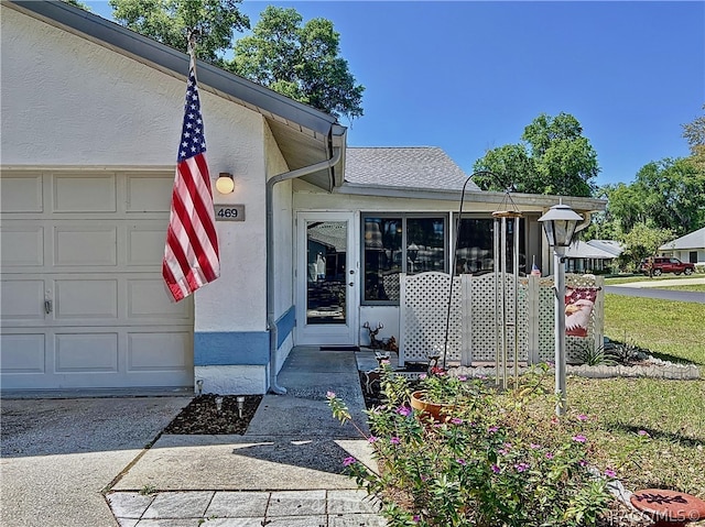 doorway to property featuring a garage