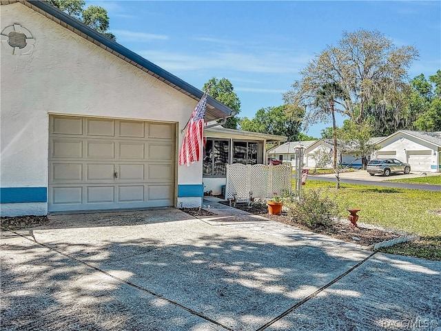 view of side of property featuring a sunroom