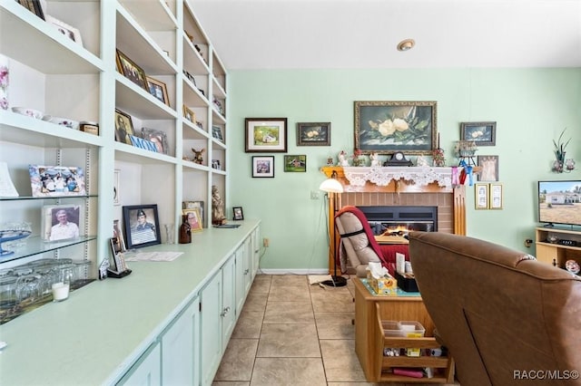 330 W Hillmoor Ln, Beverly Hills, FL 34465 - office featuring a glass covered fireplace, light tile patterned floors, and baseboards