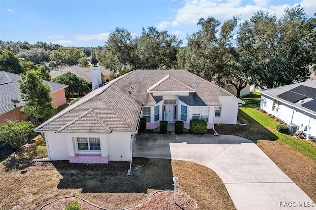 330 W Hillmoor Ln, Beverly Hills, FL 34465 - ranch-style house featuring concrete driveway, stucco siding, and central AC