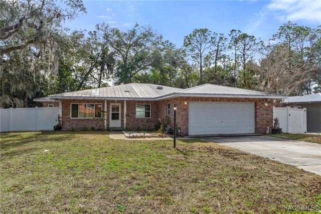 ranch-style home with a garage and a front lawn