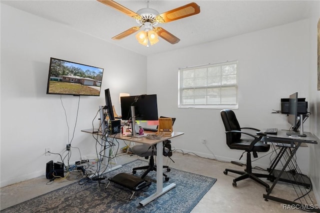 office featuring concrete floors and ceiling fan