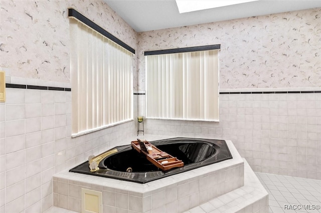 bathroom with a relaxing tiled tub