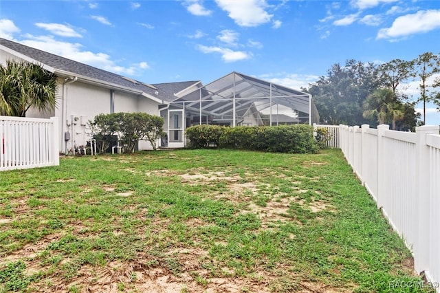 view of yard featuring a lanai