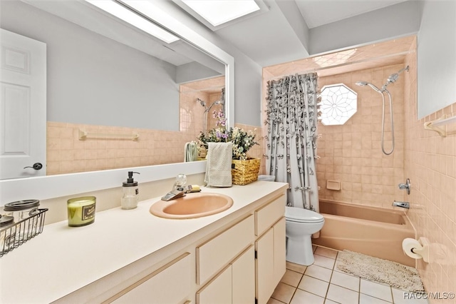 full bathroom featuring vanity, tile patterned floors, toilet, tile walls, and shower / tub combo with curtain