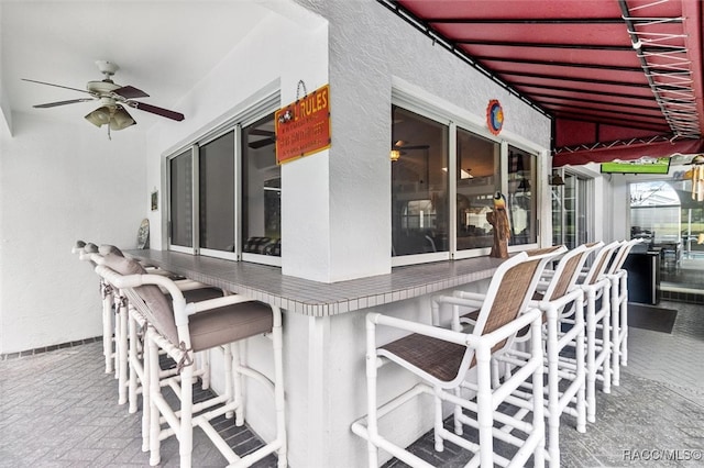 view of patio with an outdoor bar