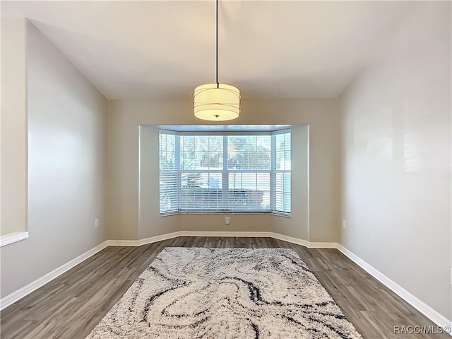 dining room with dark hardwood / wood-style flooring