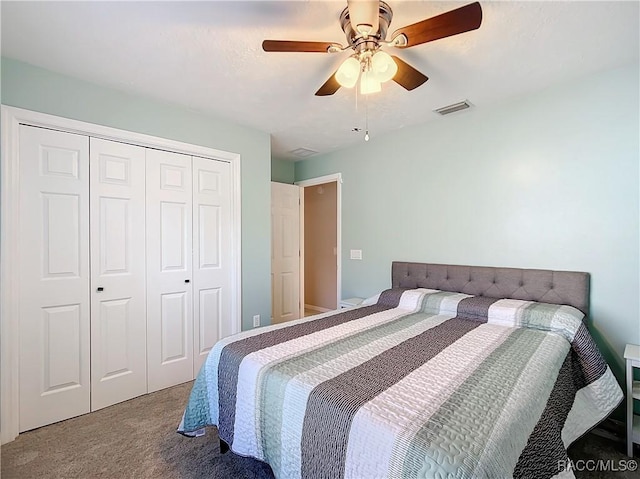 bedroom with a closet, ceiling fan, and carpet flooring