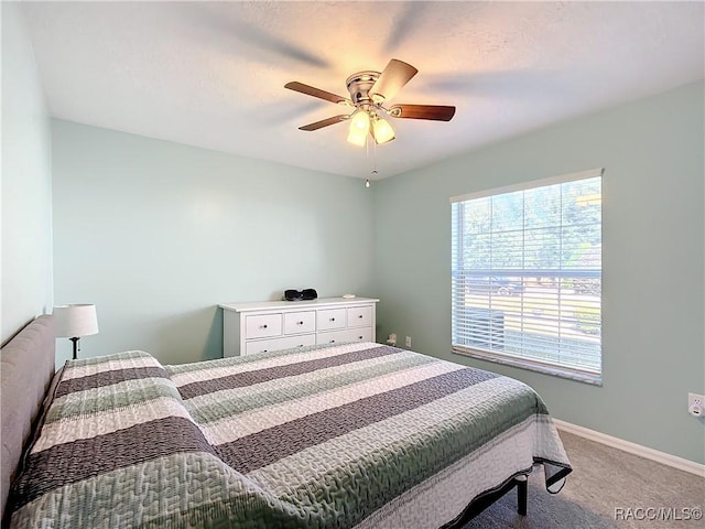 bedroom featuring ceiling fan and carpet flooring