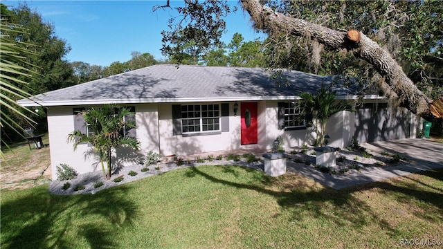 ranch-style home with a front lawn