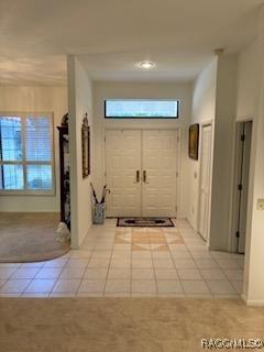 foyer featuring light tile patterned flooring