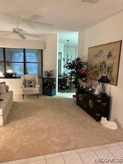 living room featuring tile patterned flooring and ceiling fan