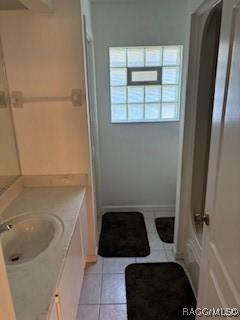 bathroom with tile patterned floors and vanity