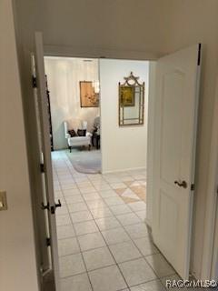 corridor with light tile patterned floors