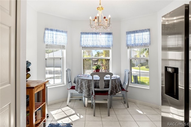 dining room featuring light tile patterned floors and a notable chandelier