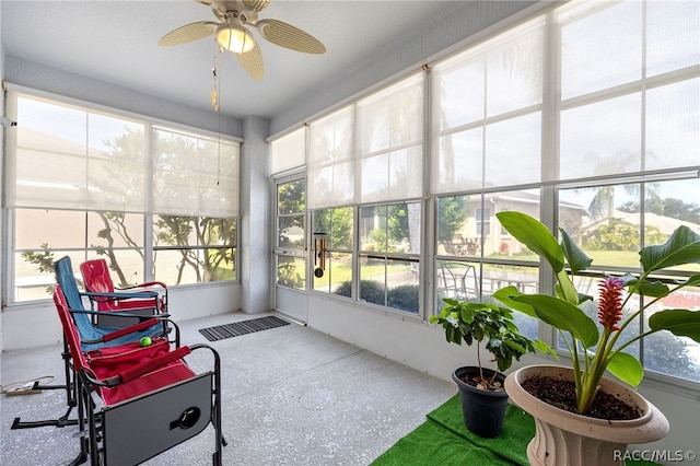 sunroom featuring ceiling fan and a healthy amount of sunlight