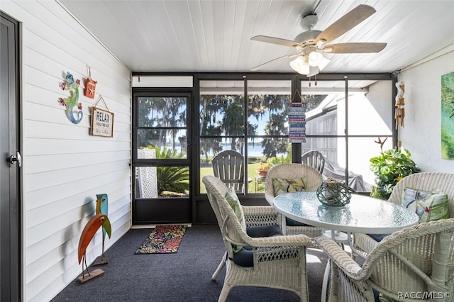 sunroom / solarium with ceiling fan and wooden ceiling