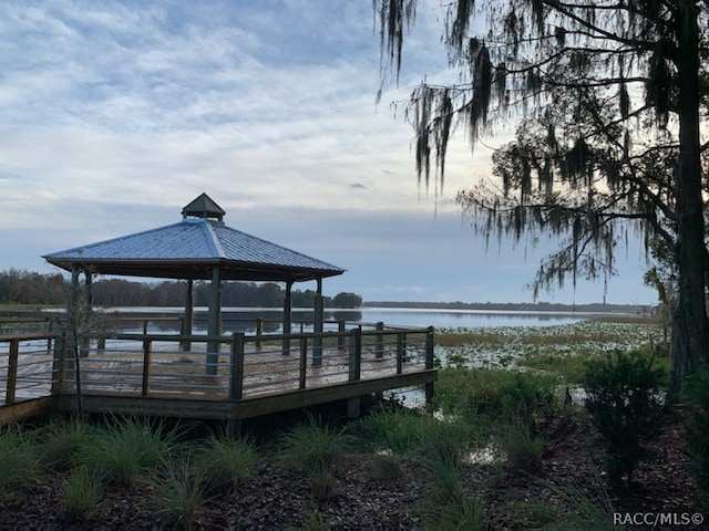 dock area featuring a gazebo and a water view