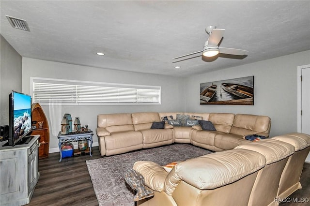 living area with dark wood-style floors, ceiling fan, visible vents, and recessed lighting