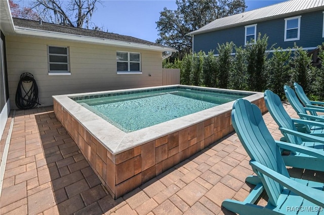 view of pool with a patio area and a pool