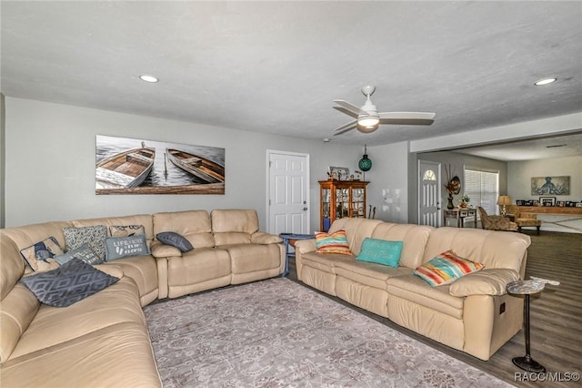 living room with a ceiling fan, recessed lighting, and wood finished floors