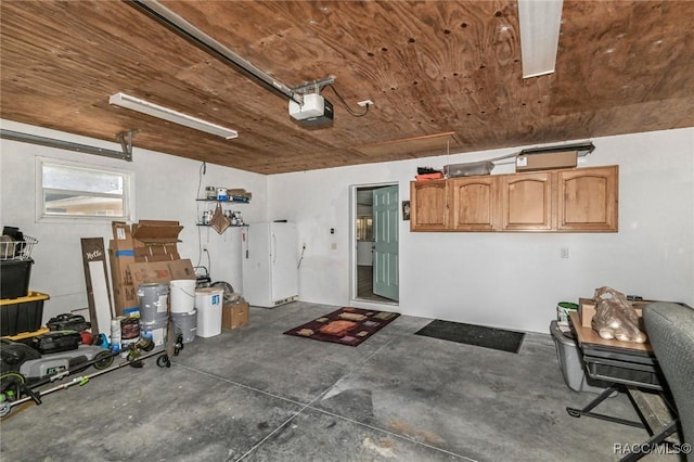 garage featuring wooden ceiling and a garage door opener