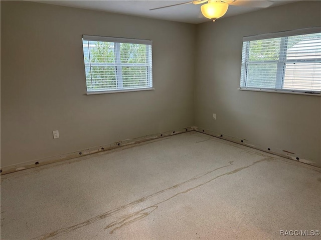 unfurnished room featuring ceiling fan