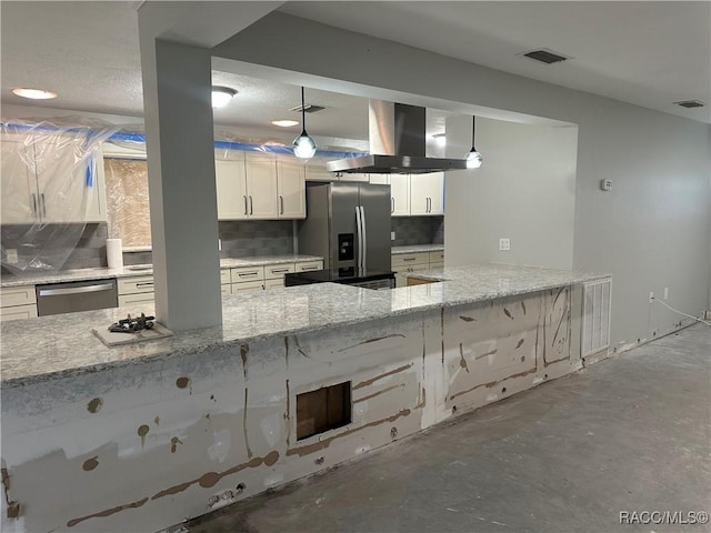 kitchen featuring visible vents, backsplash, appliances with stainless steel finishes, light stone countertops, and exhaust hood