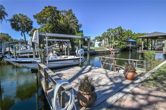 view of dock featuring a water view and boat lift