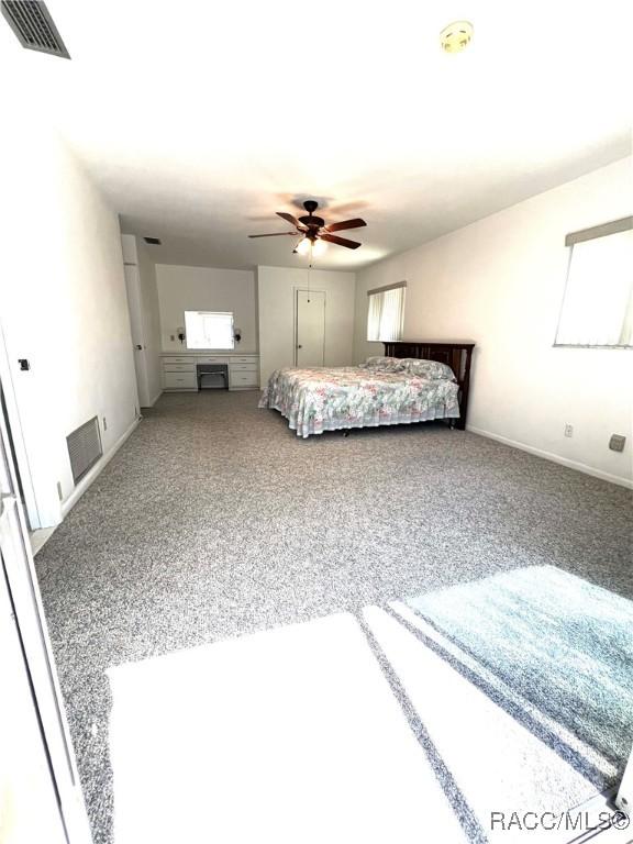 unfurnished bedroom featuring ceiling fan