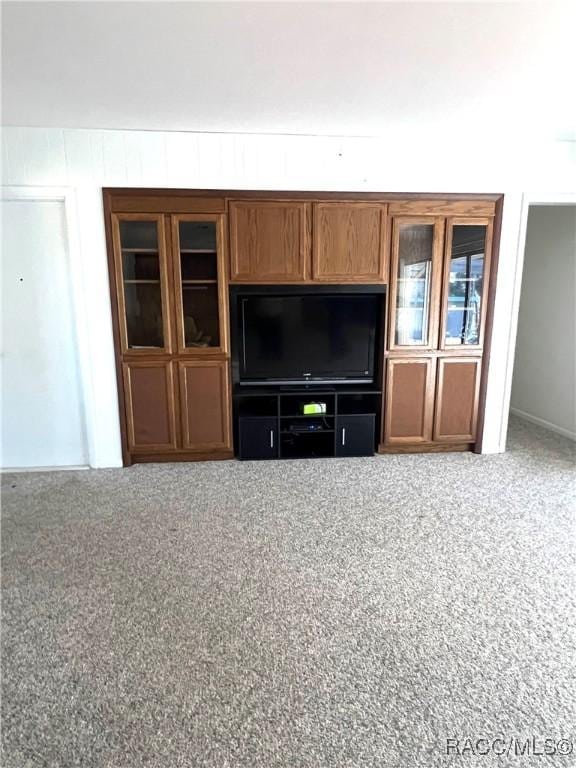 unfurnished living room with carpet