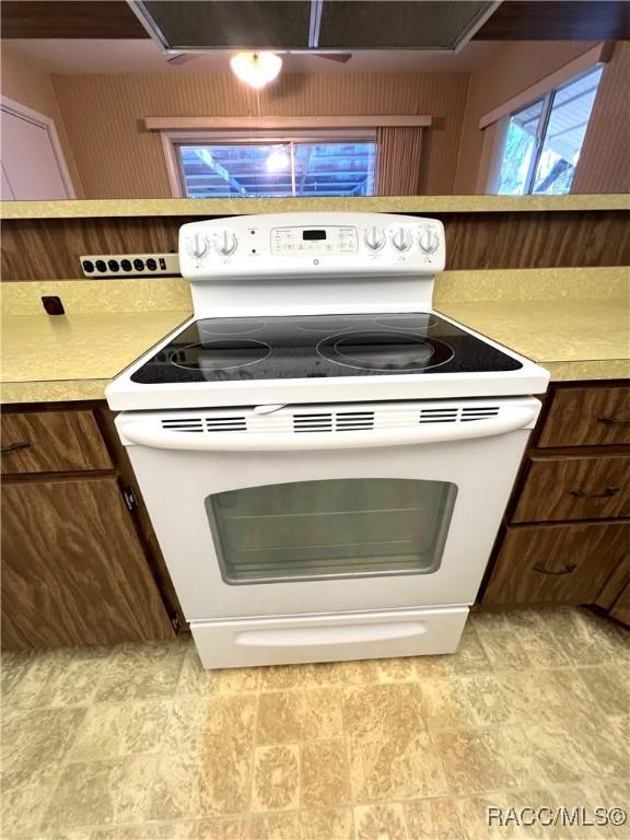 kitchen featuring white range with electric cooktop