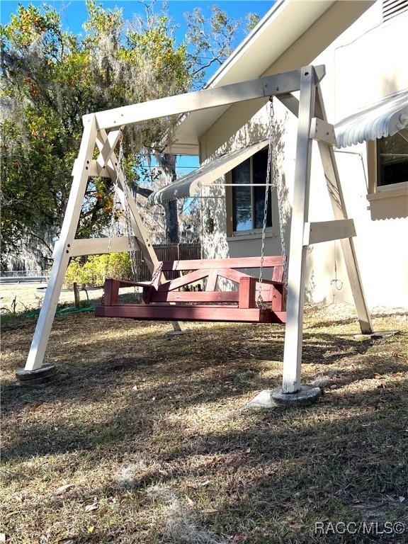 view of jungle gym featuring a wooden deck